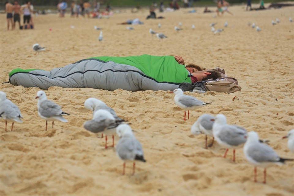 The entertainment begins at first light. There are those still partying, some with new friends, many with old friends, some swimming, many to see the first sun rise of the year & others, like these guys, sleeping.