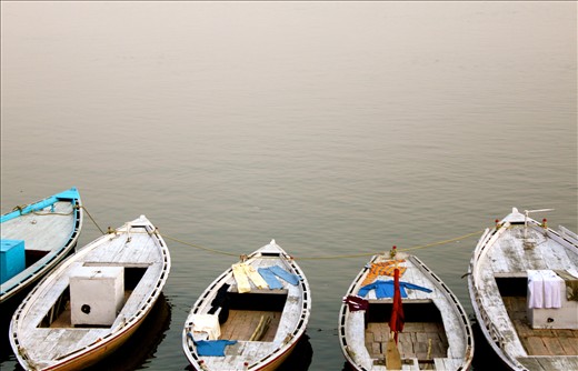 Boats along the Ganga offering a drying spot for laundry.