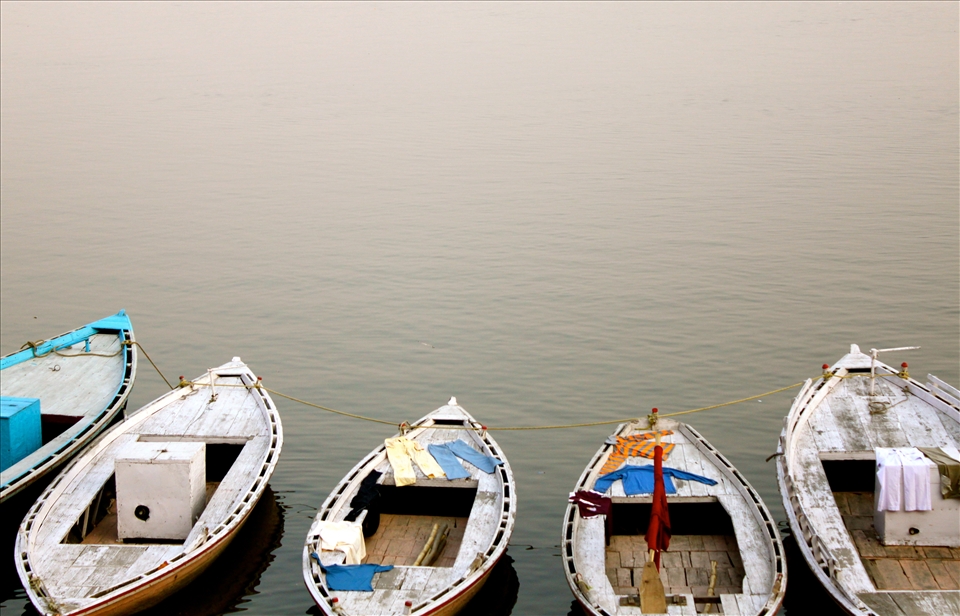 Boats along the Ganga offering a drying spot for laundry.