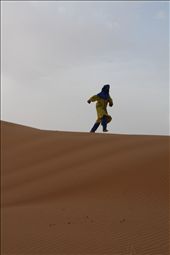 Despite the nearly 100 degree Fahrenheit heat, one guide ditches his soft leather shoes and runs up and down the dunes barefoot in his heavy garb. His laugh echoes on the wind as he runs, his sense of freedom clear.: by sarahewentz, Views[423]