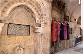 Dresses hang on the wall of a market in the centre of Jerusalems old city. The vibrant colours and patterns of the arabesque clothing nods towards modernity whilst the shape retains tradition. : by sarahg, Views[316]