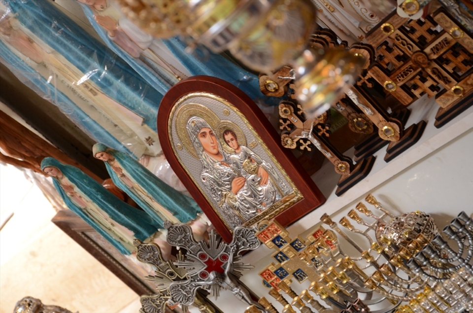 Among the various stalls in the Souk of the Old City in Jerusalem can you find items including religious depictions and menhora's. Meant mainly for tourists to take home an 'authentic' middle eastern souvenir the traditional and authentic mix with the gaudy is another experience to behold during the visit of the historic landmark.