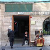 A street seller relaxes over a cigarette in the town. Traditional items such as prayer beads are sold mainly to tourists.: by sarahg, Views[127]