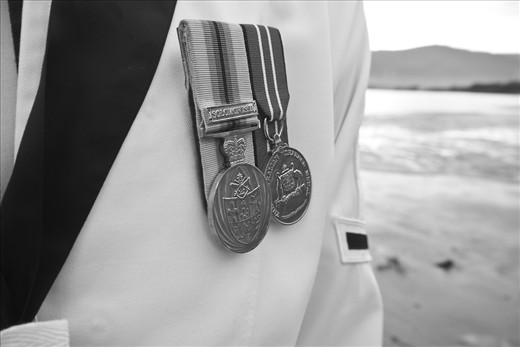A sailor wears his two earned medals on his left side of his uniform over his heart. The medal on the left side of the photo is the Australian service medal, awarded for peacetime operations and the medal on the right side is the Four year service medal, awarded to all military personnel for committing part of their lives to the protection of their country and loved ones.
