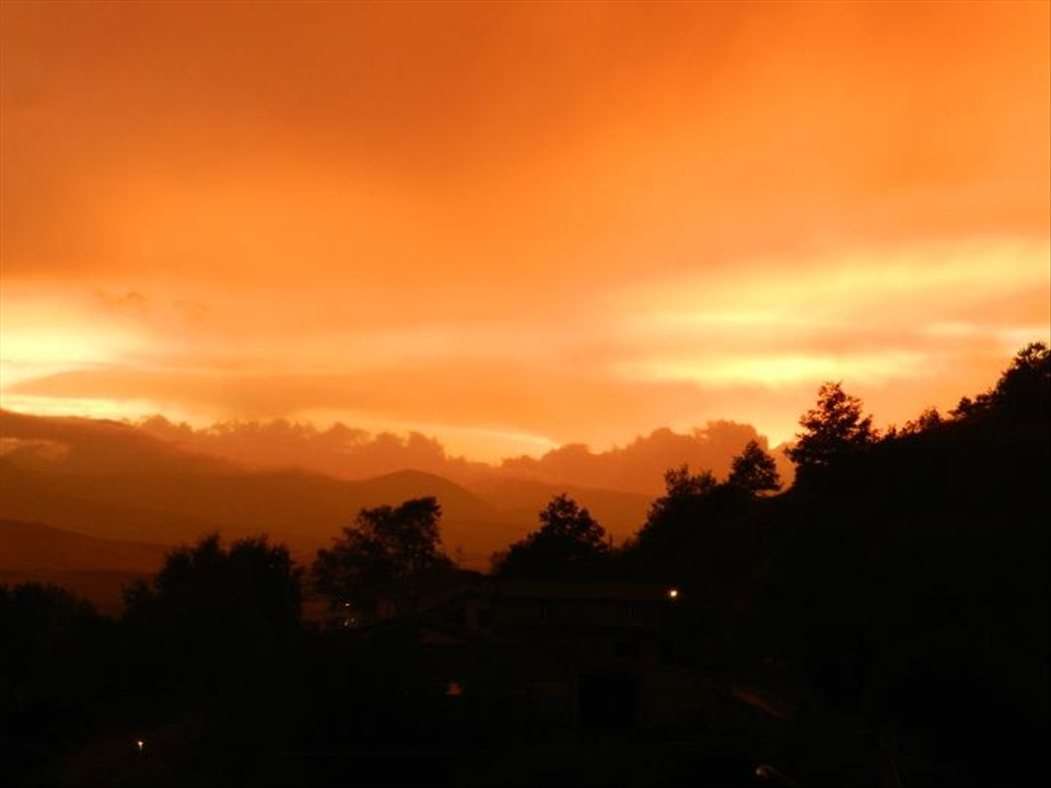 I was going for a walk, when I was enchanted by the beauty of the sunset .