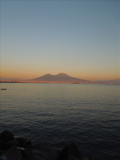The Vesuvius at sunset takes a special beauty wraps in the red of clouds.