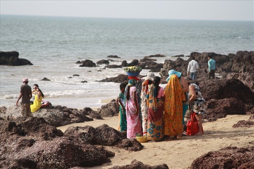 Women selling good to tourists on the scenic beaches of Goa, India.