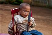 A young Hmong boy holds onto a machete used for chopping rice husk: by saskiarysenbry, Views[1151]
