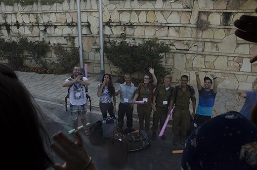 Mid-trip waving good bye to Israeli friends through the bus window, knowing most of us will never see each other again. 