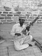 Who says talent can only be seen in reality shows..?? Here is a perfect example that not anybody can be a great artist but a great artist can come from anywhere....talent can be found anywhere...A villager of rajasthan tries to make his living by showcasing his talent to people who pass by..he plays such beautiful songs that even professionals are nothing compared to him one of the  locals said..
When asked that do you do anything besides sitting here all day and play music to earn a living.....I can only play music sir that's all I can do it's my ancestral tradition I shall play my music throughout my life and with that little bit of money I can live my life peacefully besides I got 3 kids to feed and I cannot do anything better than playing this musical instrument...he said....: by scholarship_greenland, Views[465]