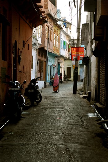 This is where she walks every morning, on the dark and narrow streets.