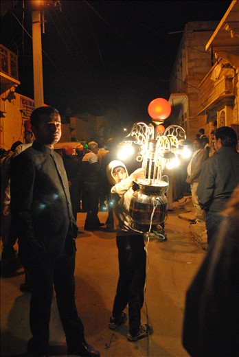 And in the evening their second son carries the lanterns.