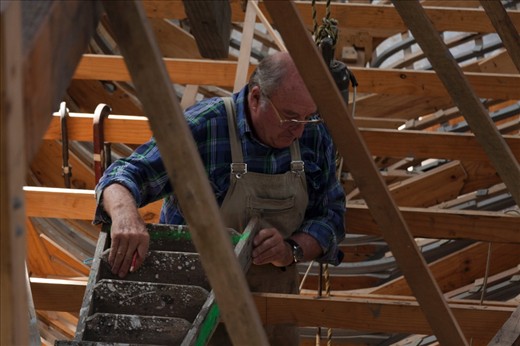 Master craftsman and educator Adrian Dean working in the belly of the beast.