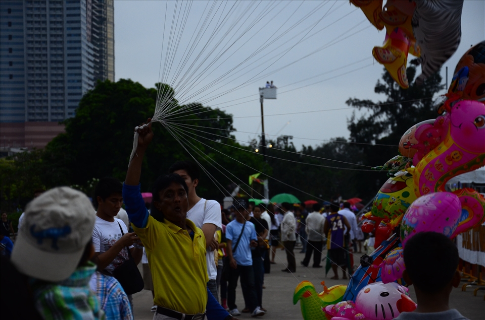 A blind man holding on to his source of income