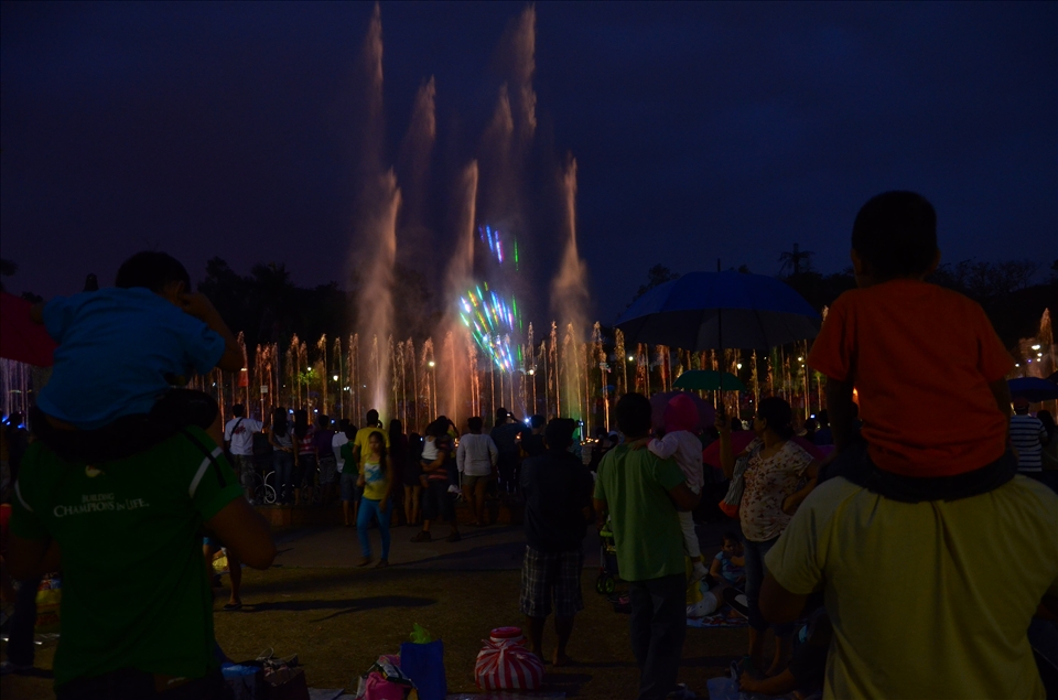 A child covering his ears because of the show while another enjoys it