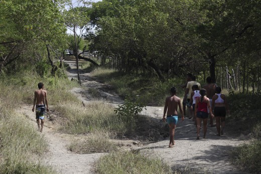 Group of people going up to the mud volcano in Arboletes, Colombia. 