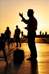 A magician performs his act against the falling sun in Glenelg, South Australia.: by sebriebolge, Views[281]