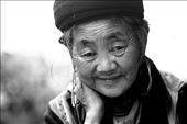 An elderly Black Hmong Lady, stares gently into the camera in the morning before making the walk into Sa Pa town to collect the essentials for the week.: by sebriebolge, Views[354]
