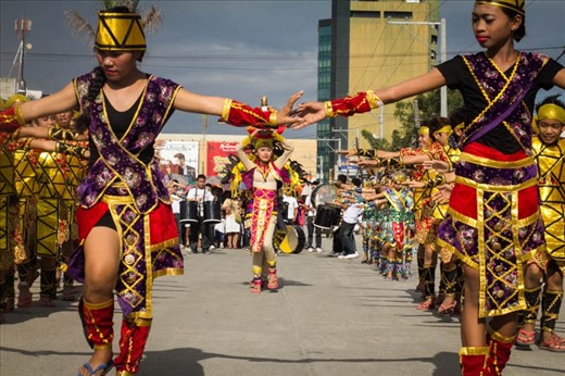 Performers line up on the street early in the afternoon, rehearsing the final performance before the 'Sinulog ng Kabataan, an annual festival in cebu performed by children to honor the infant jesus, begins. 
