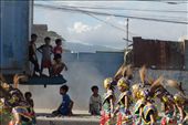 Children take cover from the blazing sun under the shadow of a large container truck as the parade begins.: by seed_ifferent, Views[274]
