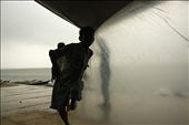 The kids of fishermen leave their play to take shelter. Distant boats wait.: by seethrough, Views[385]