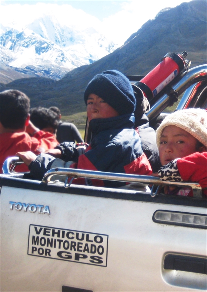 Behind the scenes

I took this picture on a tour through the National Parks in Huaraz. While all the participants were interested in the mountains and the skyline, I was more interested in the scene behind...the kids that are living and working there.