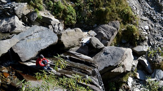 A reader on a cliff in Mcelodganj, Himachal Pradesh