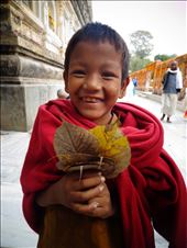 A young monk collecting holy leaves in Bodhgaya, India: by seth_monk, Views[246]
