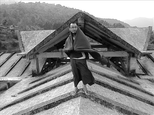 Portrait of a monk on the roof at Rumtek, India 