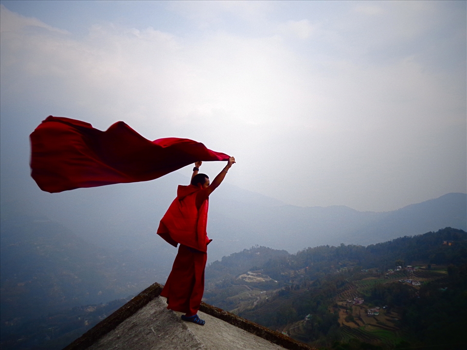 A Tibetan monk testing the wind in Sikkhim, India