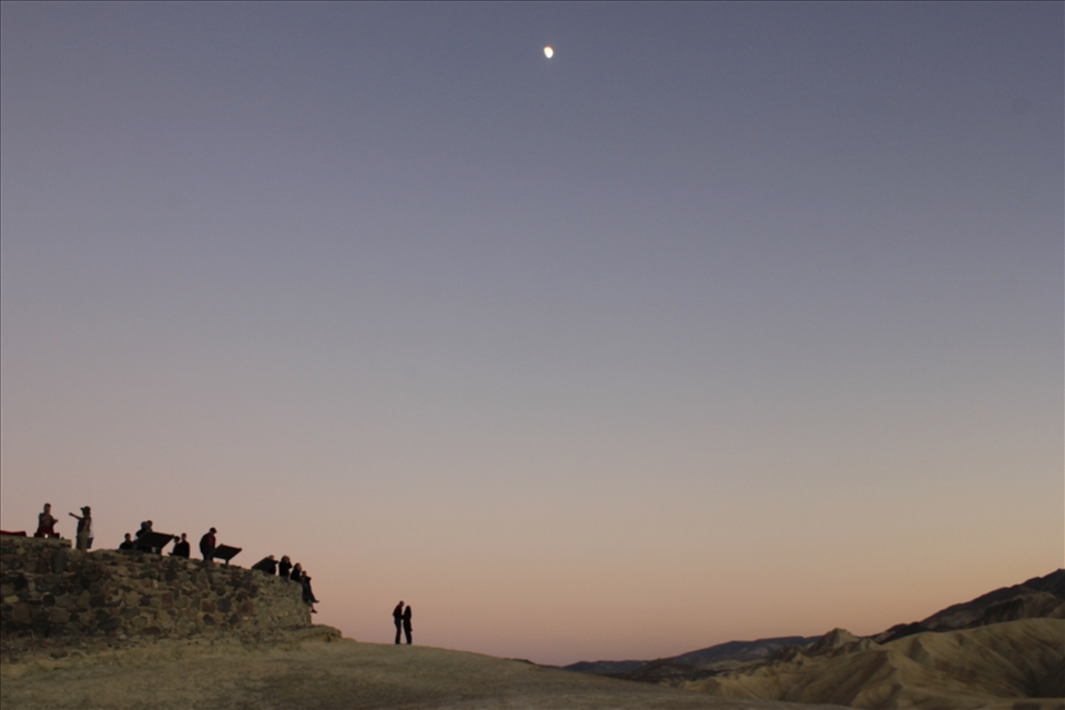 Dancing in the moon light, As a I looked around the erratic terrain, the bad lands of Death Valley. A couple held each other in an intense dialogue and I saw an orchestra waiting to play waiting to play their symphony.