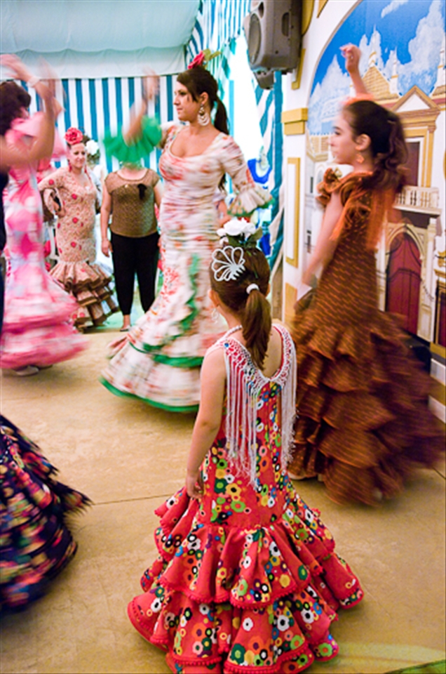 Young girl looking her older friends dancing during the 