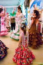Young girl looking her older friends dancing during the 