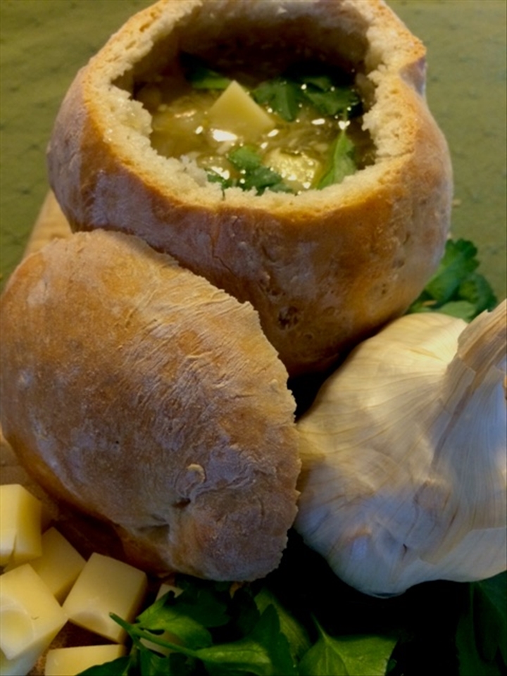 Czech garlic soup in a cumin bread bowl