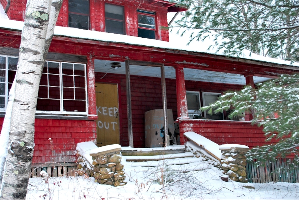 The irony of the sign is that although it may keep human passerby from going in, it hasn't kept nature out. Slowly the surrounding woods have taken over. 