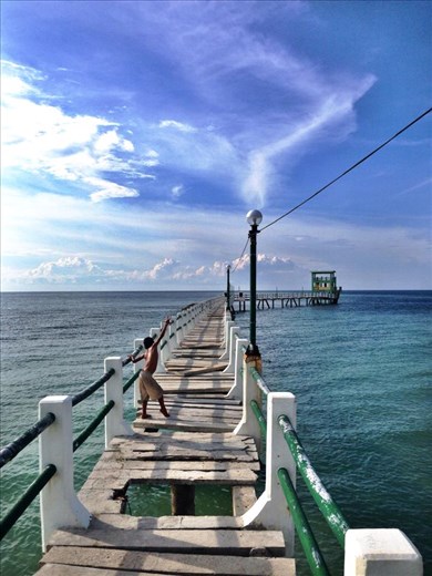 This is one of my favorite piers in the world.   I asked the boy to pose for a p