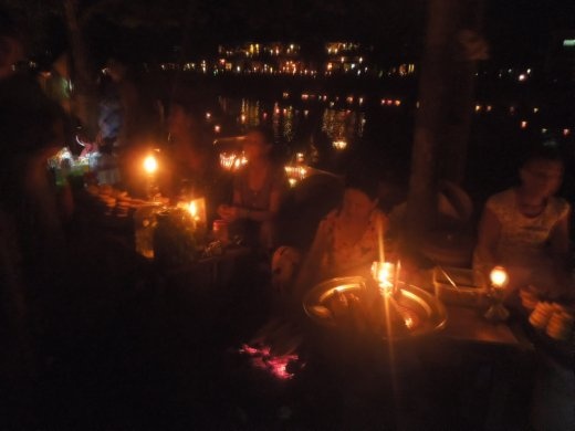 Little ladies set up their stoves along the river to sell food to everyone at the festival
