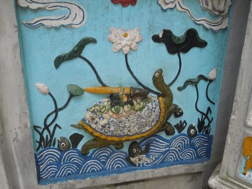 The temple was full of these ceramic reliefs- this one depicting the legend of the sword coming out of the lake on the back of the turtle god