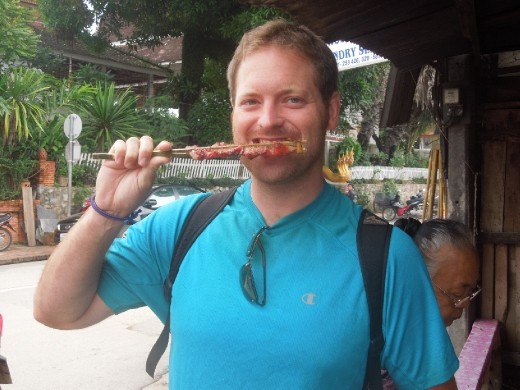 Joe enjoying his first meat on a stick for breakfast... delicious!