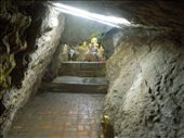 Peering through this little cave shrine to the Buddhas within- this shrine is called Wat Tham Phu Si.: by sglass, Views[214]