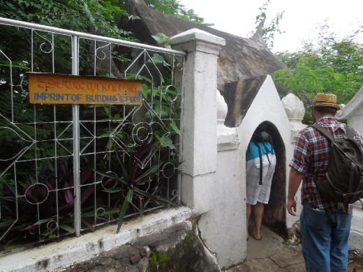 Viewing Buddha's footprint inside that little house! Couldn't get a good enough picture of it... but it was huge. And sort of foot-shaped.