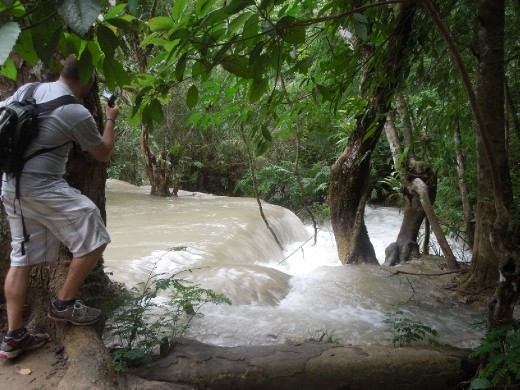 Leading up to the Kuang Si Waterfall... fast-flowing pools of water gushing over natural tiers. Joe gets in close for our video footage...