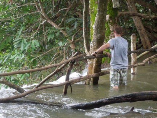 Last picture before I stash my camera safely out of harm's way and wade out there with Joe! We climbed up on the rail and leaned out over the edge... staring straight down as thousands of gallons of water rush over... so cool!