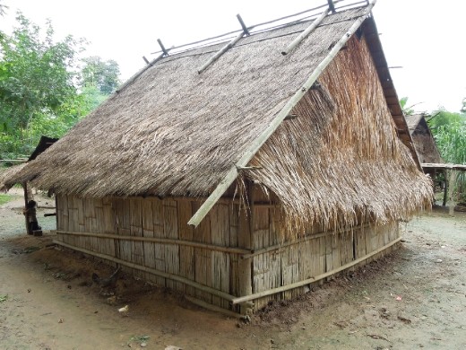 A traditional Hmong house- no stilts and no windows. Religious beliefs differ from tribe to tribe, but many of the Hmong worship spirits (phi) and believe that having windows will enable bad spirits to get into their houses.