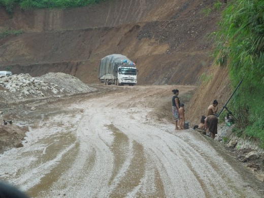 Trying to get a shot of the quality of the roads in Laos... accidentally captured this little guy gettin a bath!