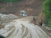 Trying to get a shot of the quality of the roads in Laos... accidentally captured this little guy gettin a bath!: by sglass, Views[176]