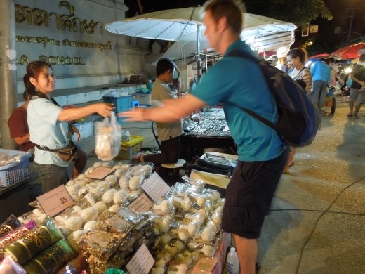 Joe shopping for gifts at the night market