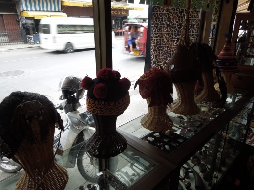 Different hill tribe hats for sale in a shop