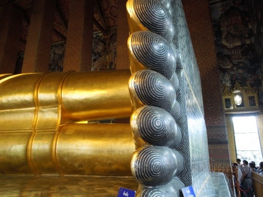 The feet are completely inlaid with mother of pearl