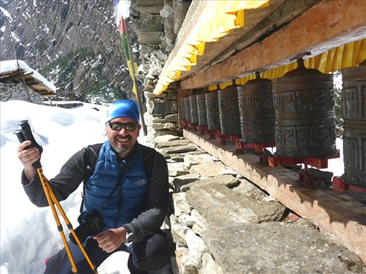 Mani wall with prayer wheels.  Sho.